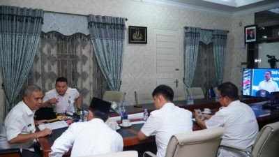 Pj Bupati Kampar Hadiri Rakor APIP dengan APH Melalui Zoom Meeting